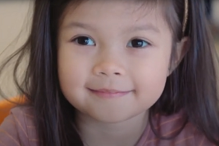 A still image of a 3-year-old girl taken from the CAHS informational video 'Look at me, I am 3'